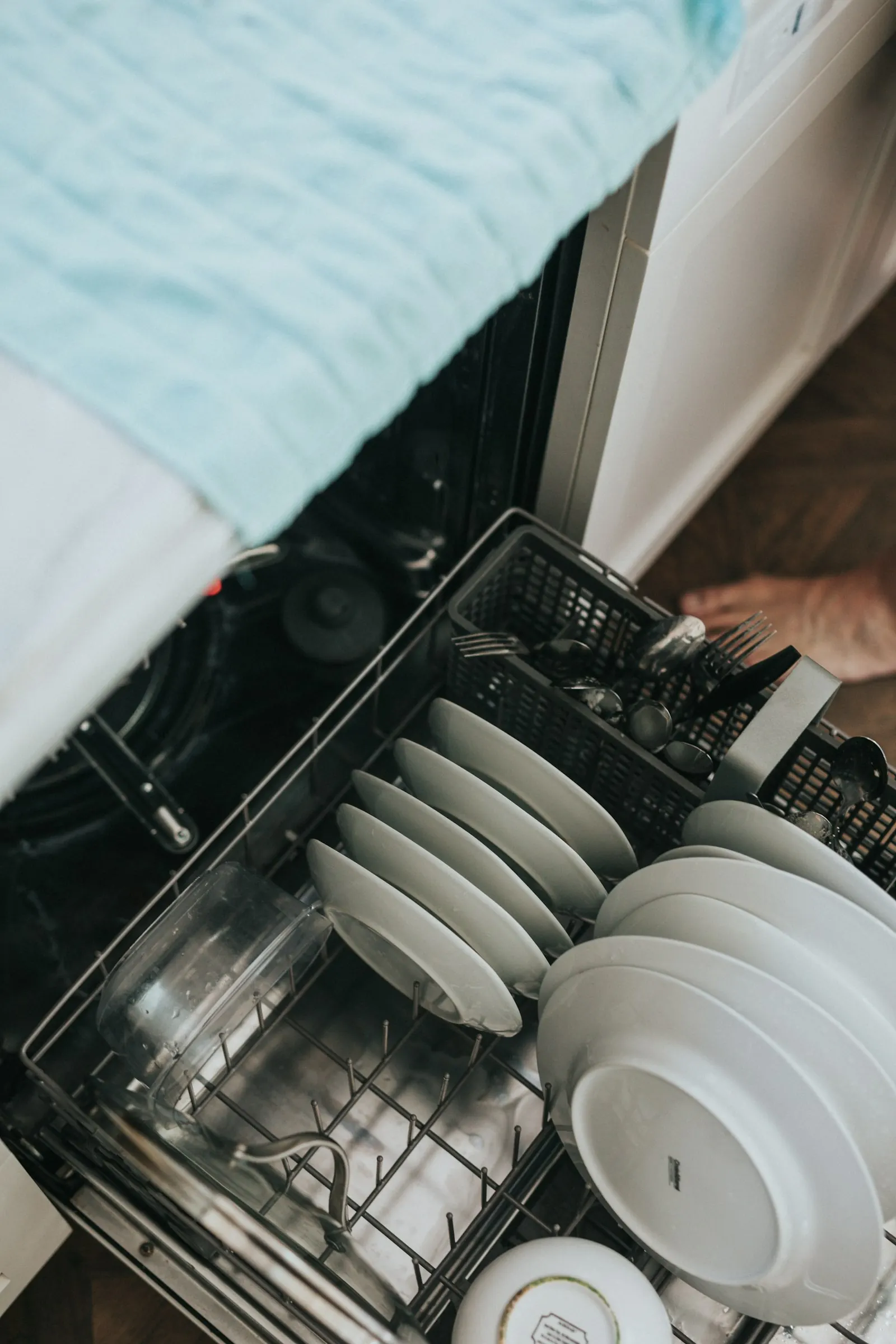 Dishwasher not draining repair - technician clearing a drain pump in Decatur GA